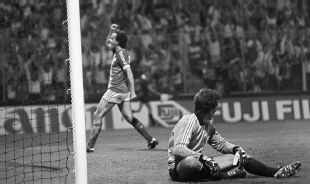 Michel Platini celebrates scoring against Yugoslavia